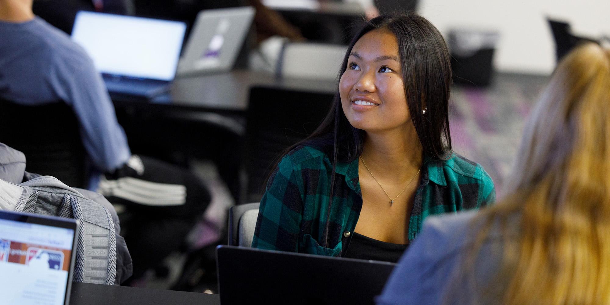 Female Student Listening In Class